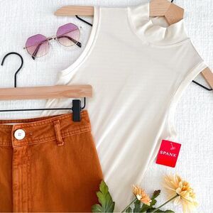 SPANX sleeveless mockneck bodysuit.
